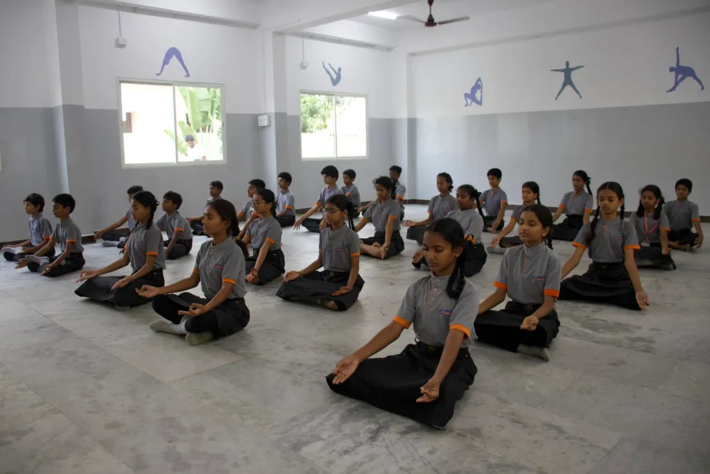 Students in the yoga and activity hall at Brigade Public School, Gurramguda campus