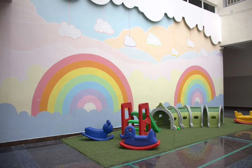 Rainbow mural in the pre-primary play area at Brigade Public School, Gurramguda campus