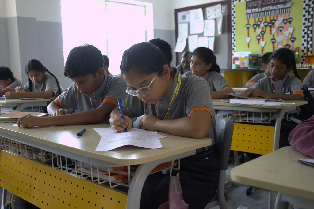 Senior students writing in class at Brigade Public School, Gurramguda campus